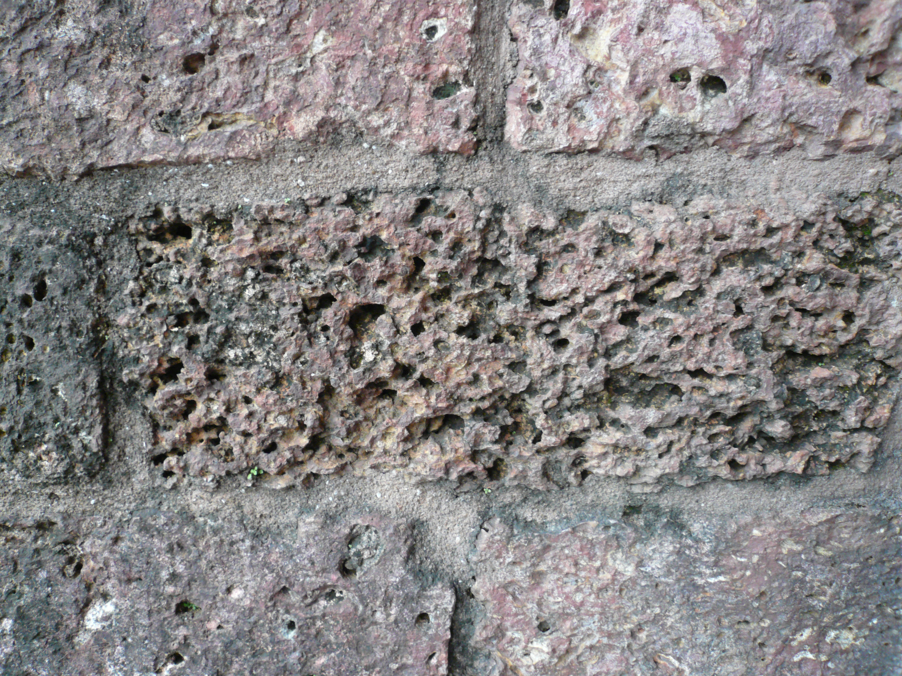 The wall block in the wall of the ancient church in India made of the similar rock